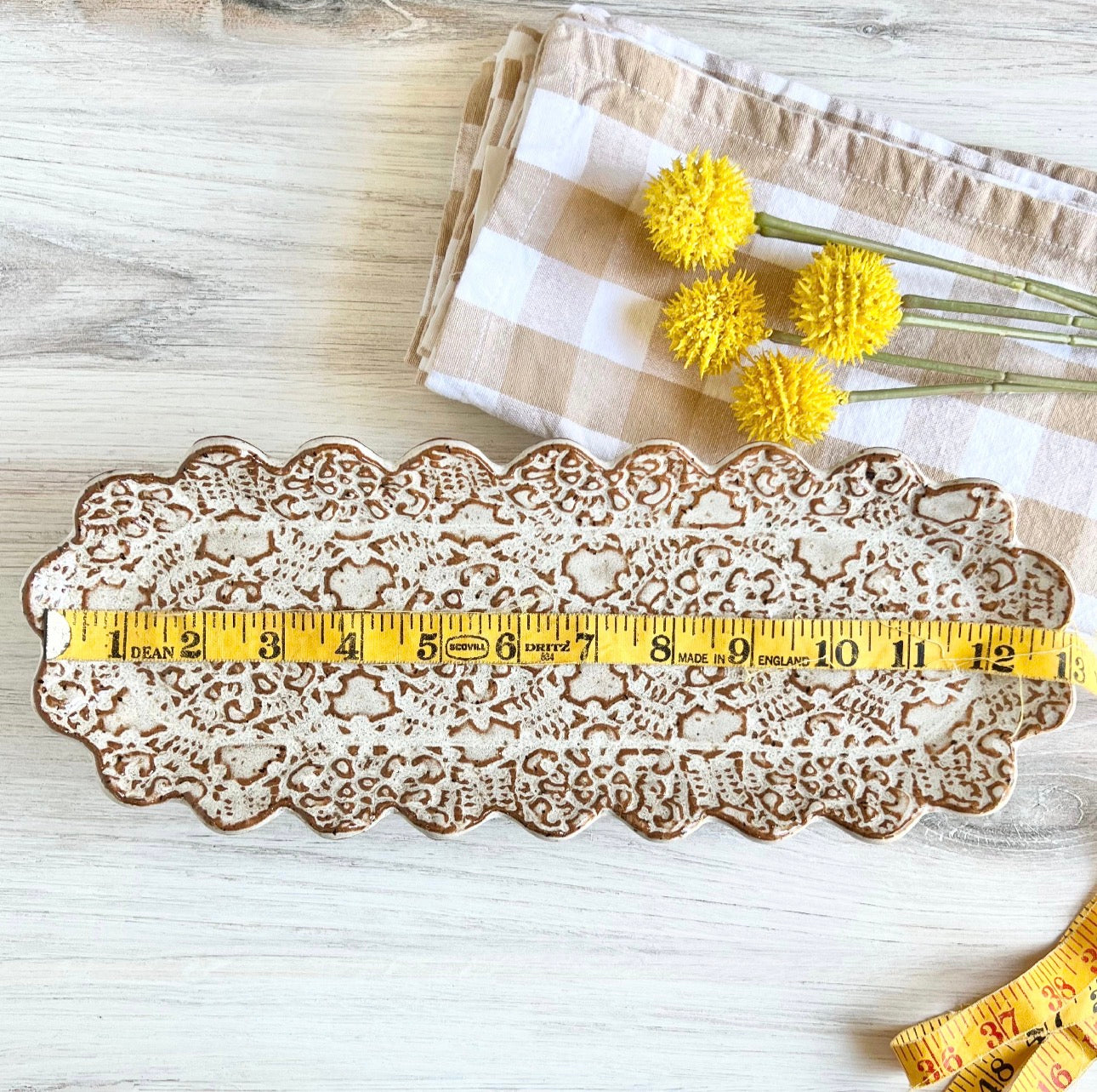 Oblong platter, white on brown clay