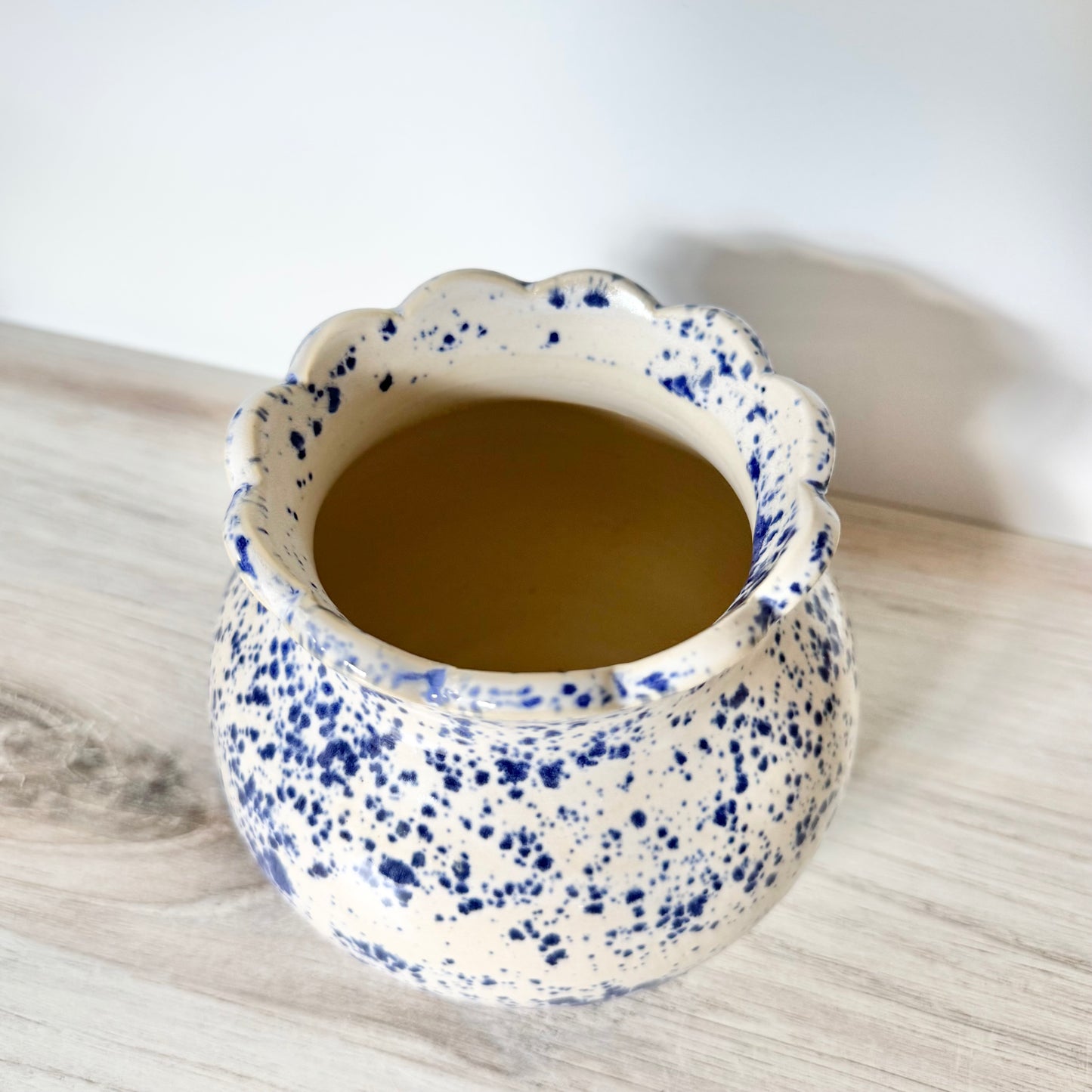 Scalloped vase, blue splatterware