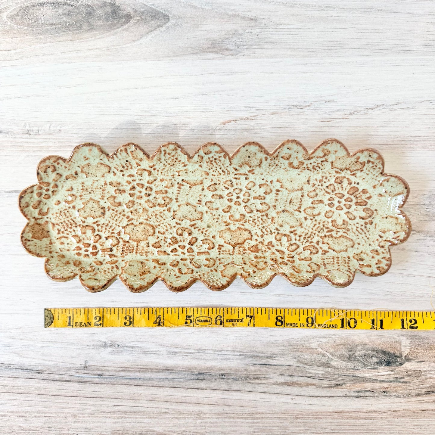 Oblong scalloped platter, mint green on brown clay