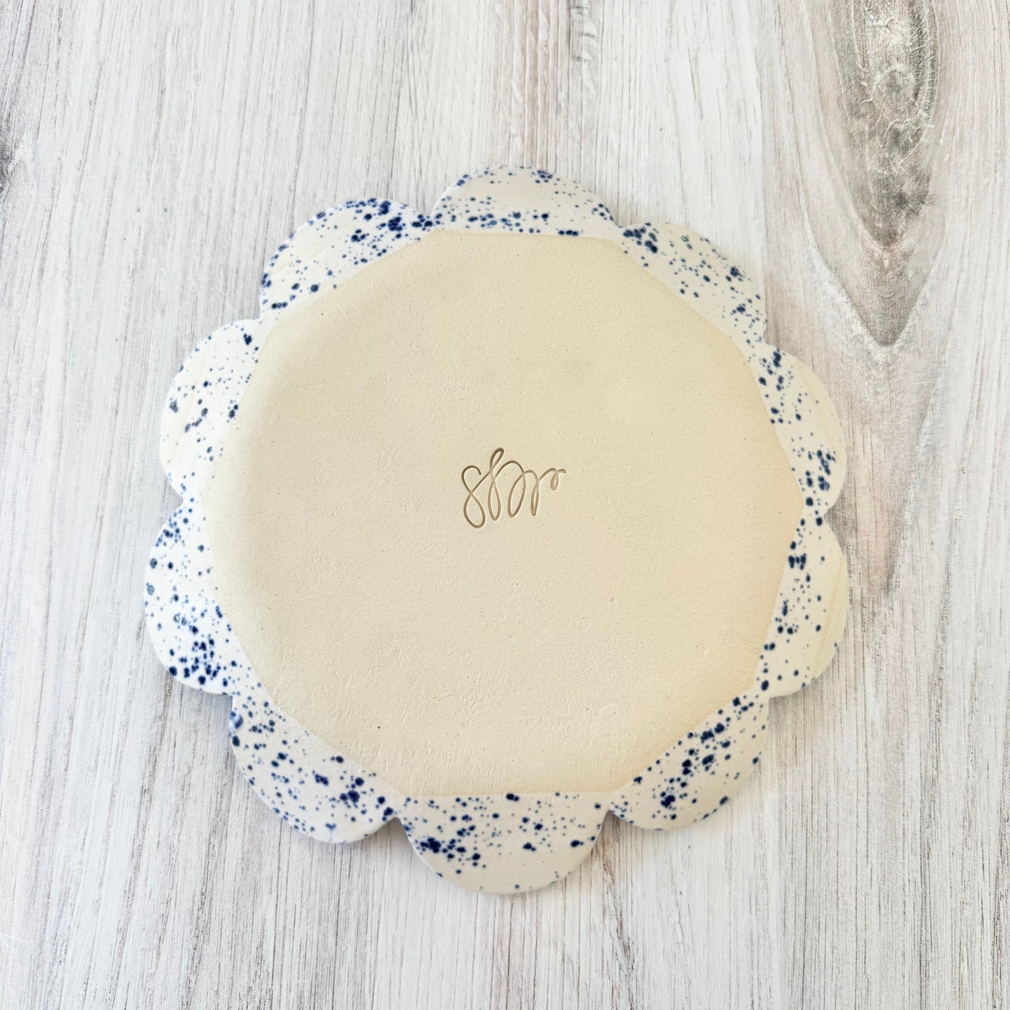 Scalloped plate, blue splatterware