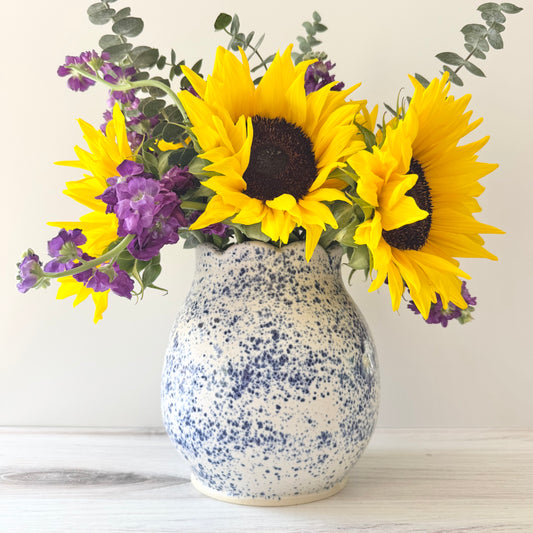 Scalloped vase, blue splatterware