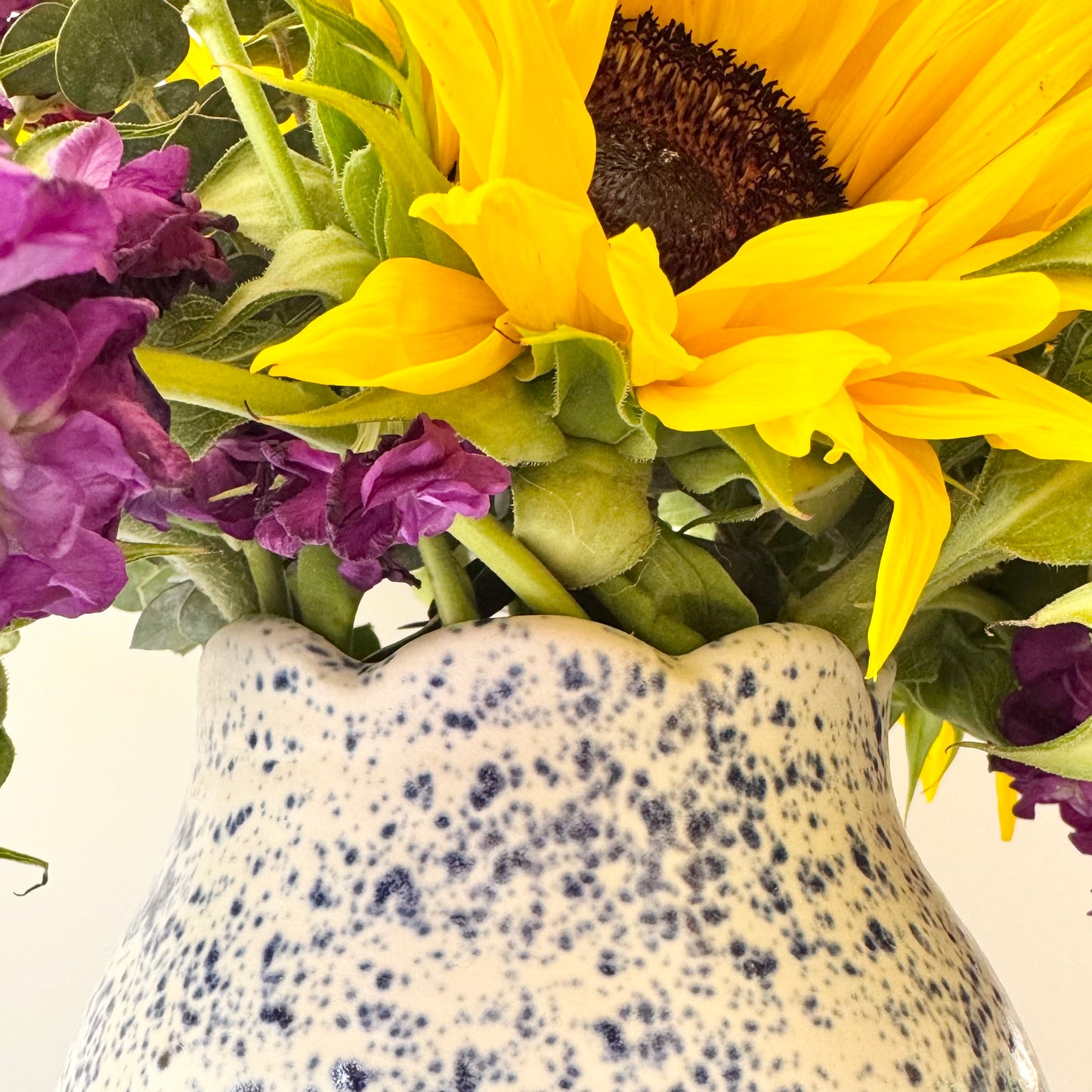 Scalloped vase, blue splatterware
