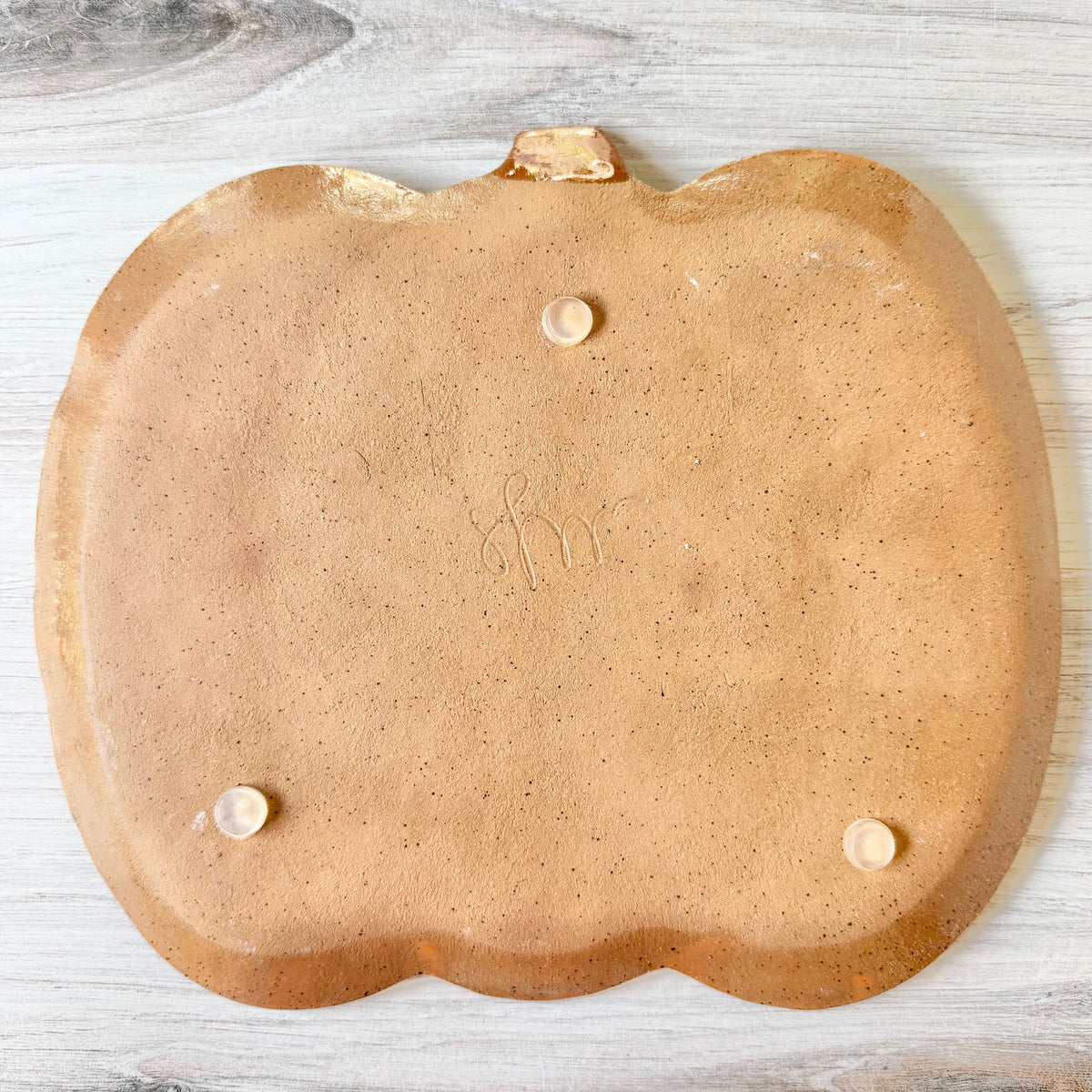 Pumpkin platter, orange on brown clay