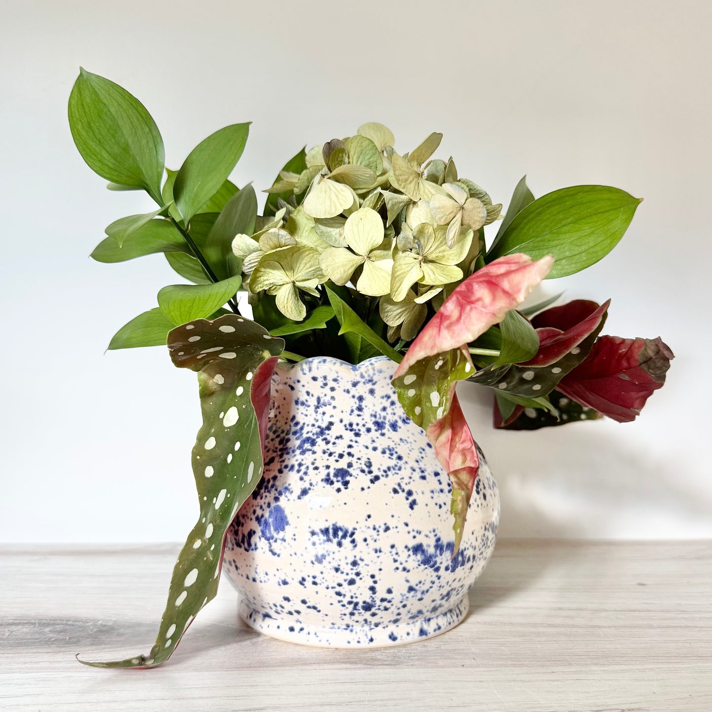 Scalloped vase, blue splatterware