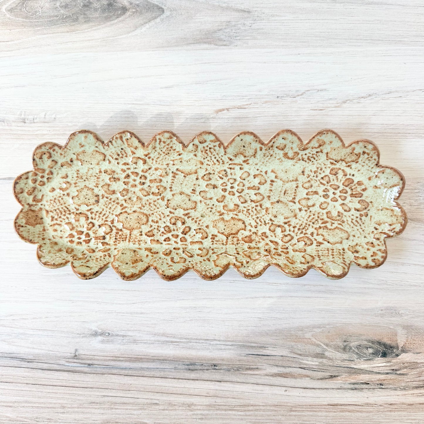 Oblong scalloped platter, mint green on brown clay