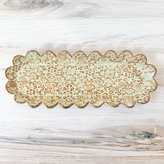 Oblong scalloped platter, mint green on brown clay