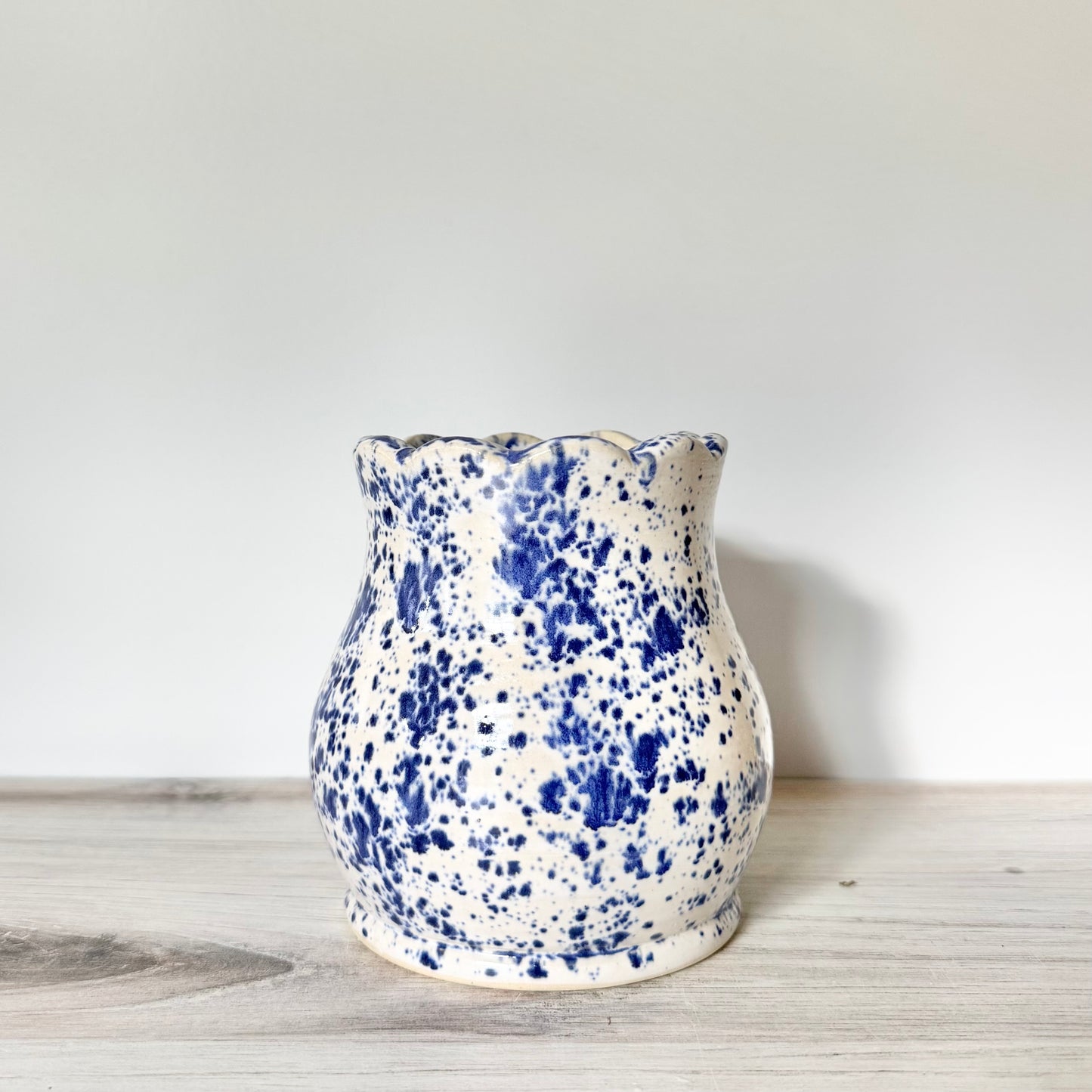 Scalloped base, blue splatterware