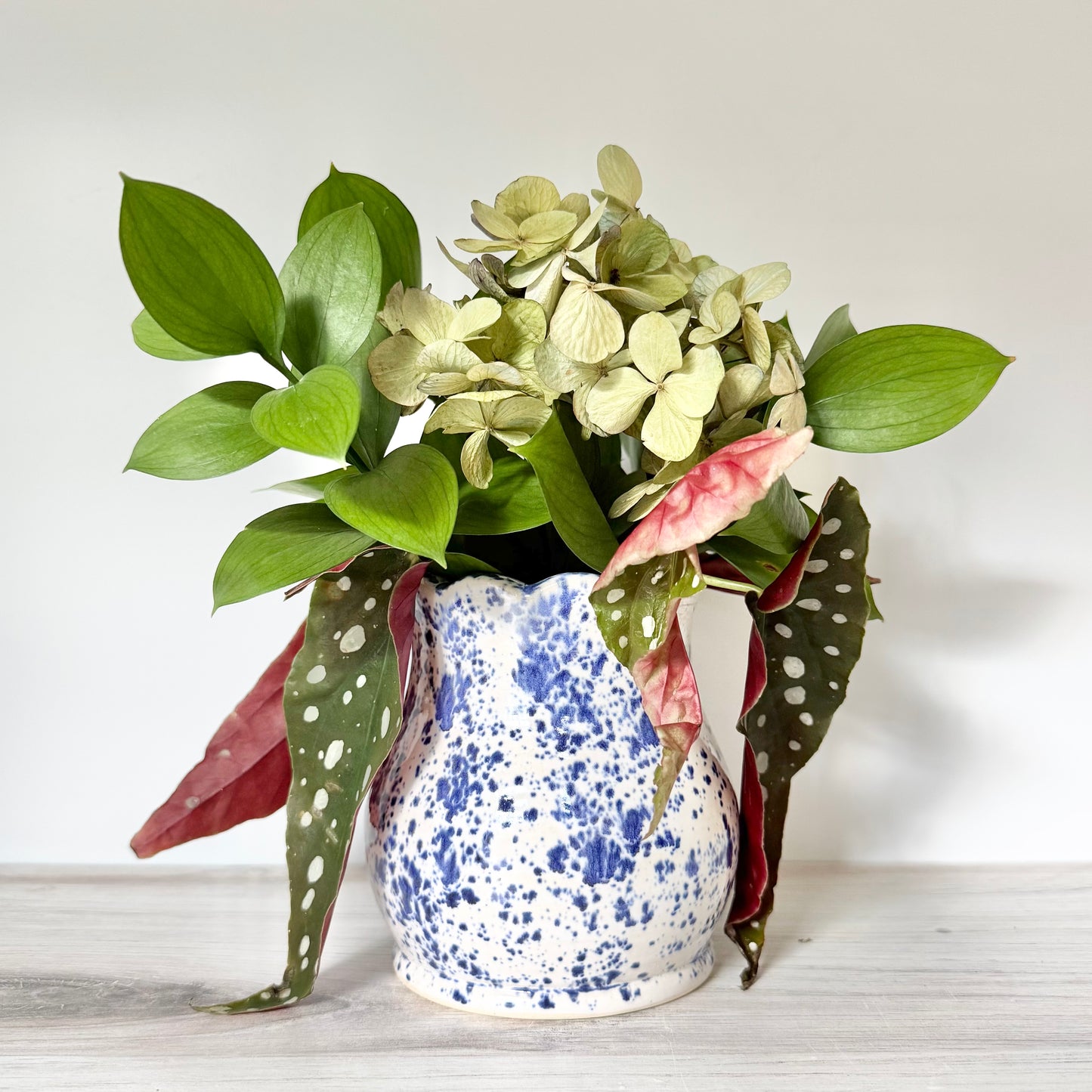 Scalloped base, blue splatterware