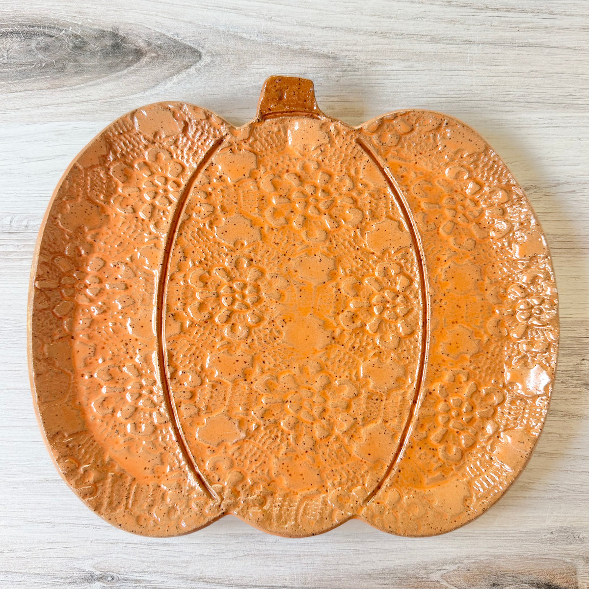 Pumpkin platter, orange on brown clay