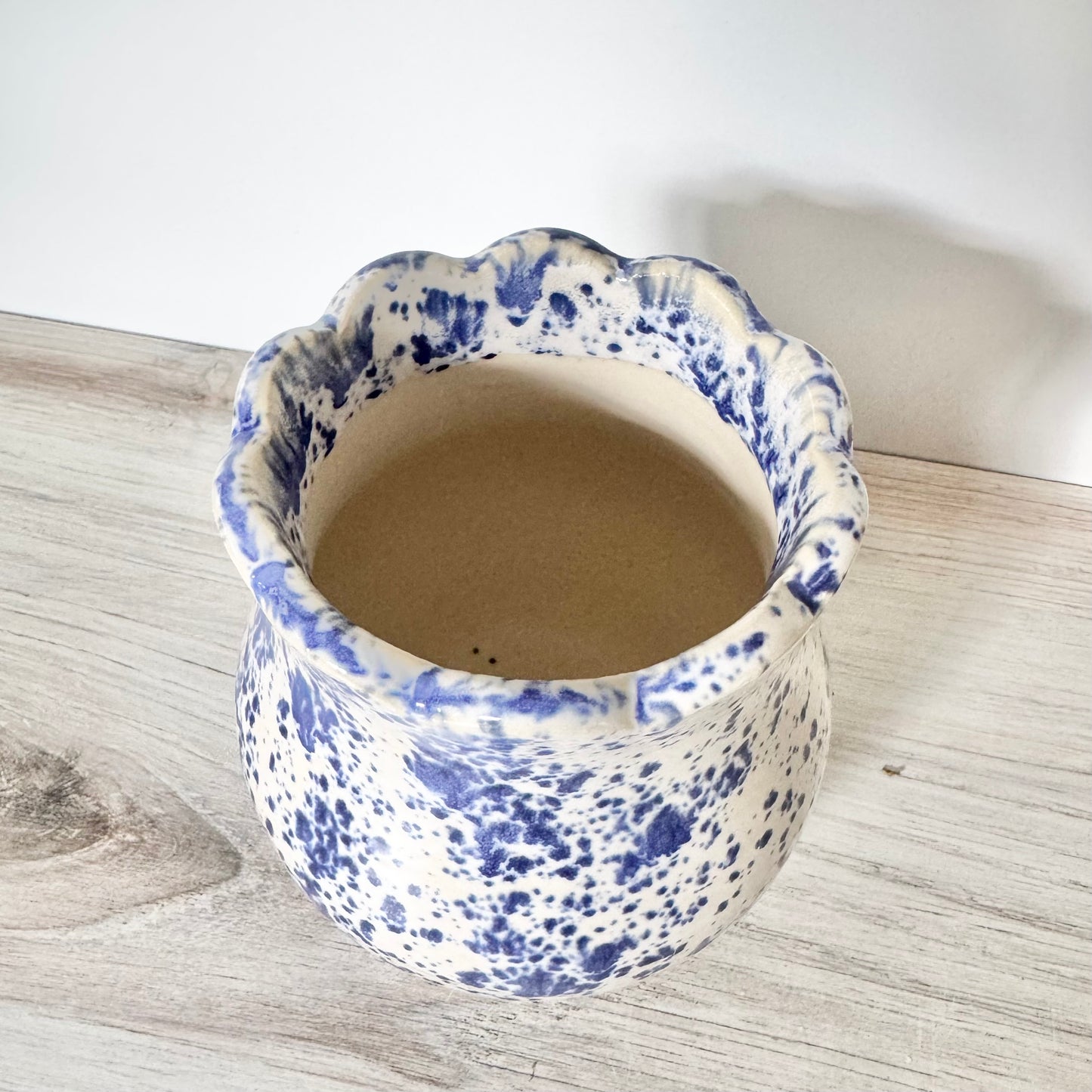 Scalloped base, blue splatterware