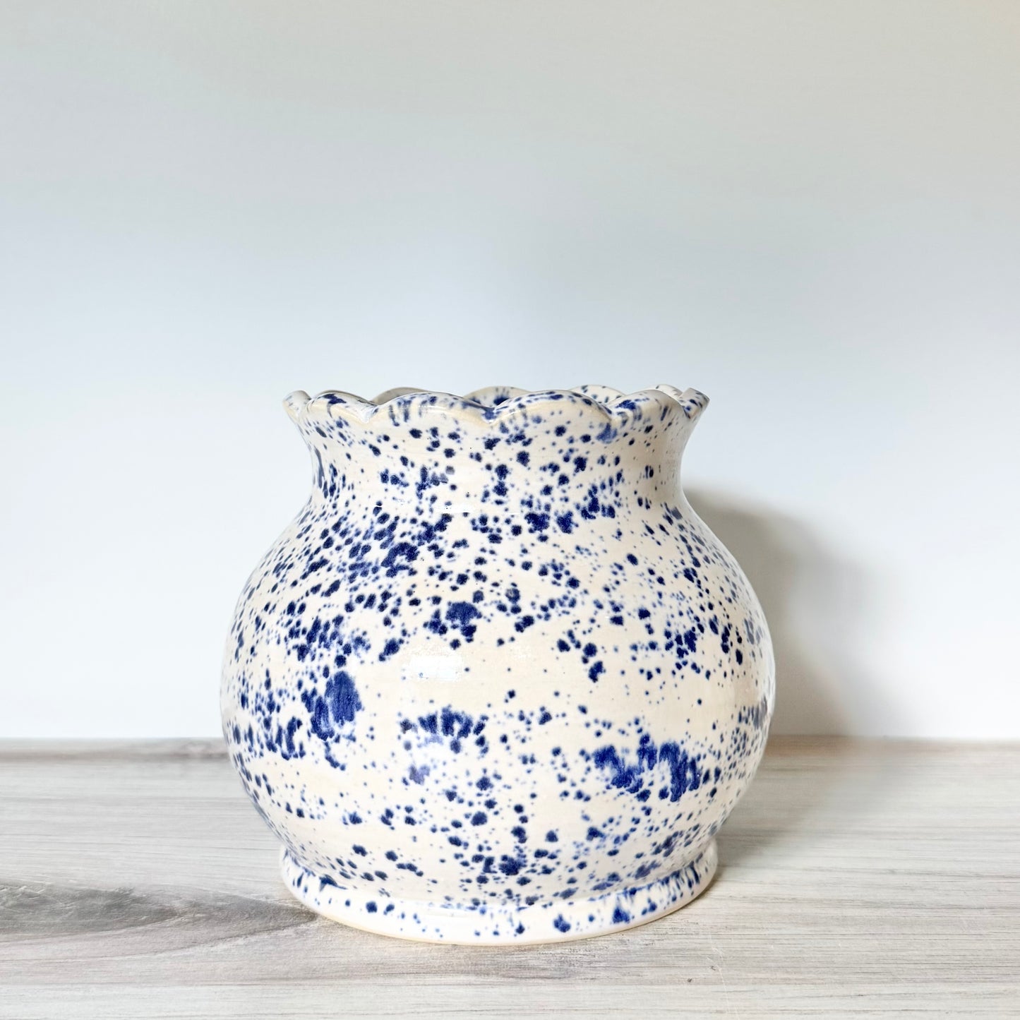 Scalloped vase, blue splatterware
