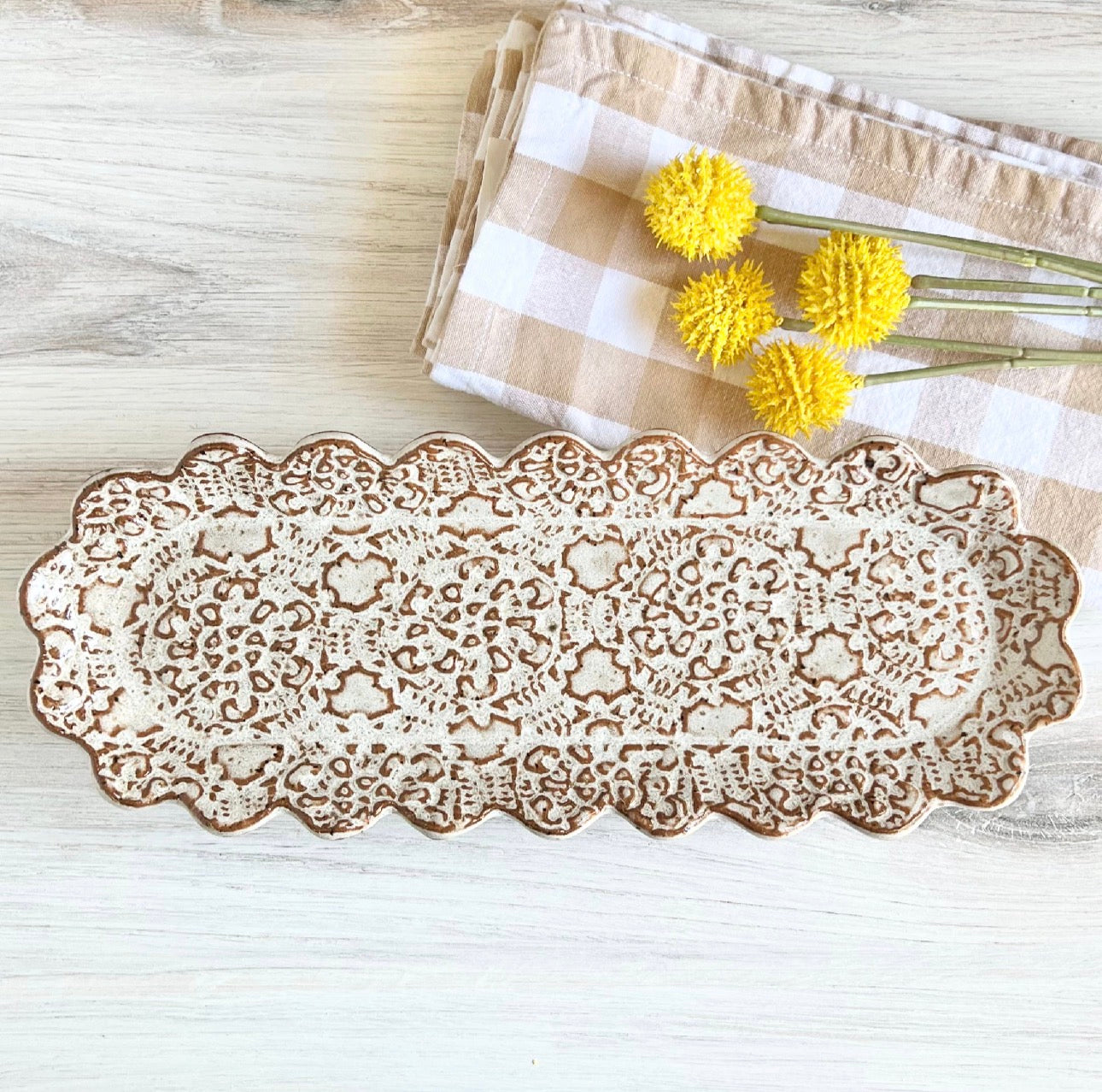 Oblong platter, white on brown clay
