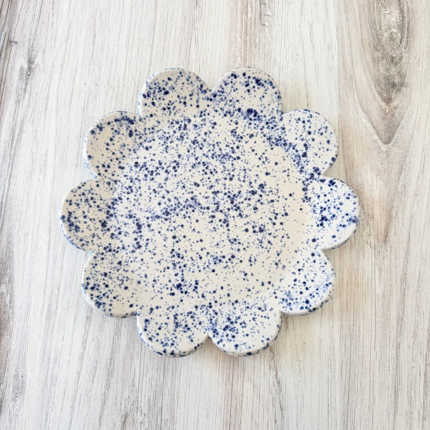 Scalloped plate, blue splatterware