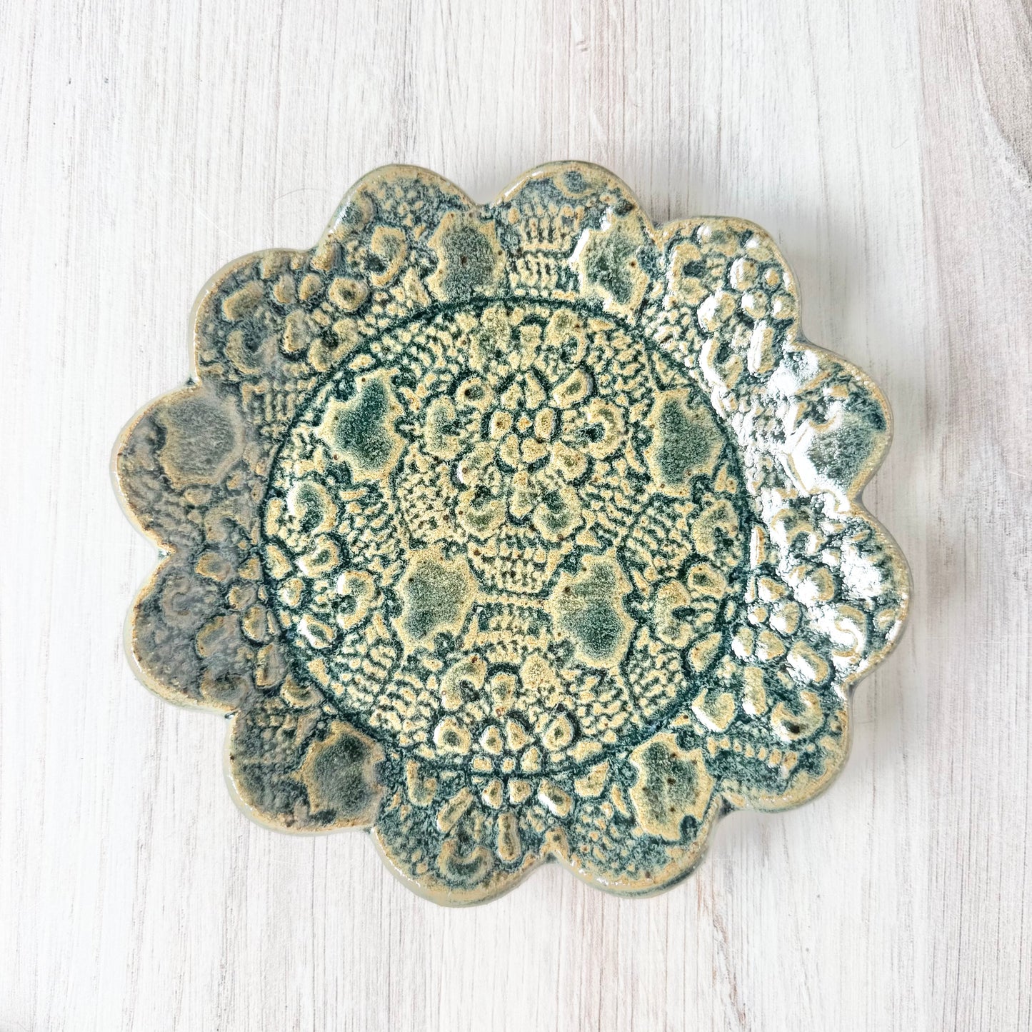 Round scallop spoon rest, antique blue on brown clay